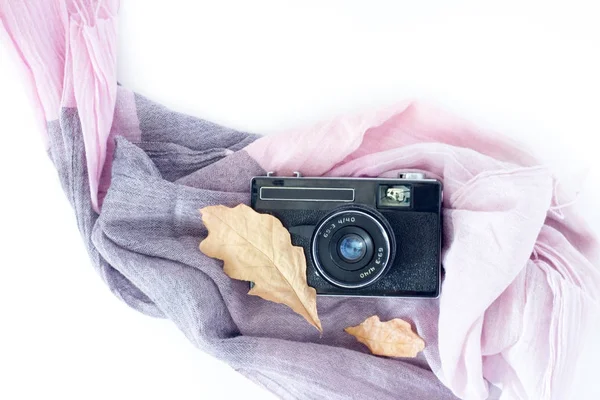 Top view of vintage old camera, scarf and leaves on white table. Concept graphic design workplace — Stock Photo, Image