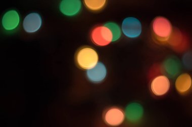 koyu arka plan üzerinde renkli Bokeh soyut .