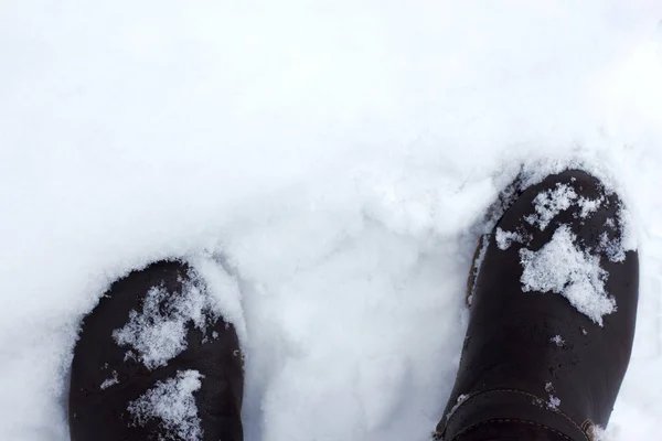 Botas en la nieve —  Fotos de Stock