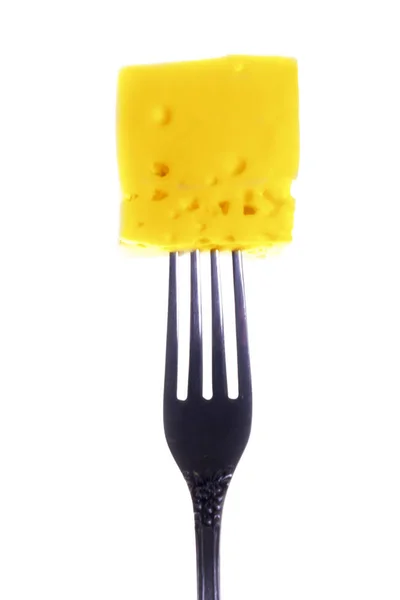 Смачний шматочок сиру на виделці Стокове Зображення