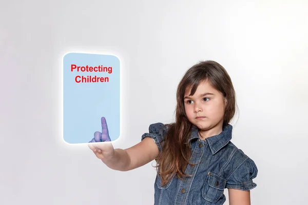 Little girl with is touching a transparent rectangle with inscri — Stock Photo, Image