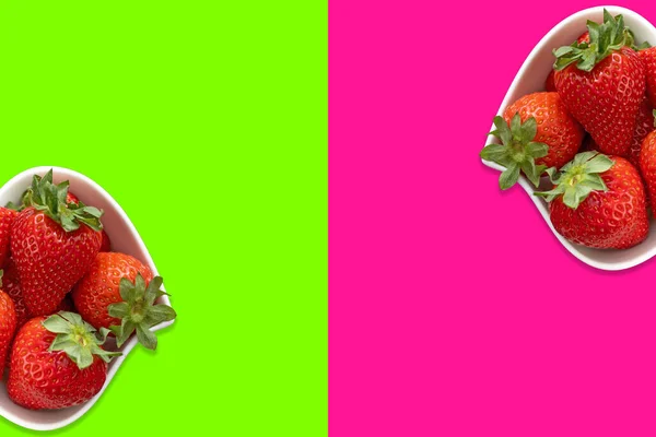 대접에 딸기는 분홍색으로 배경에 나뉘어 사진에 수있습니다 — 스톡 사진