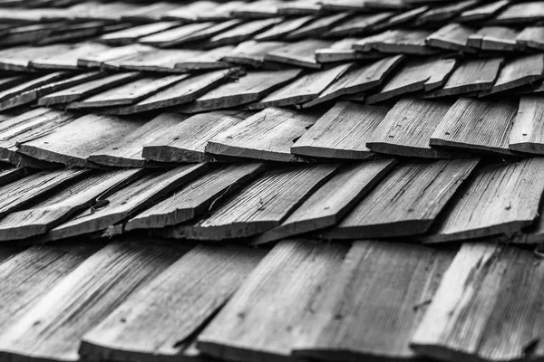 Old Wooden shingles roof, black and white texture pattern. Authentic and ancient concept