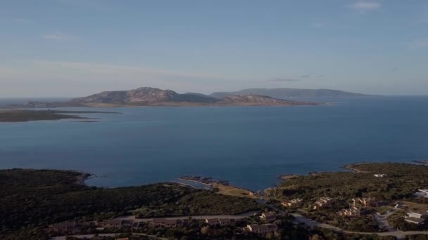 Aerial of a pretty village in Sardinia, Italy. Sunrise on the coast — Stock Video