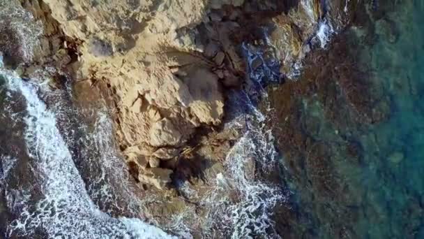 Aerial beautiful view. Waves are washing on stones and pebbles on the shore. Calpe Spain — Stockvideo