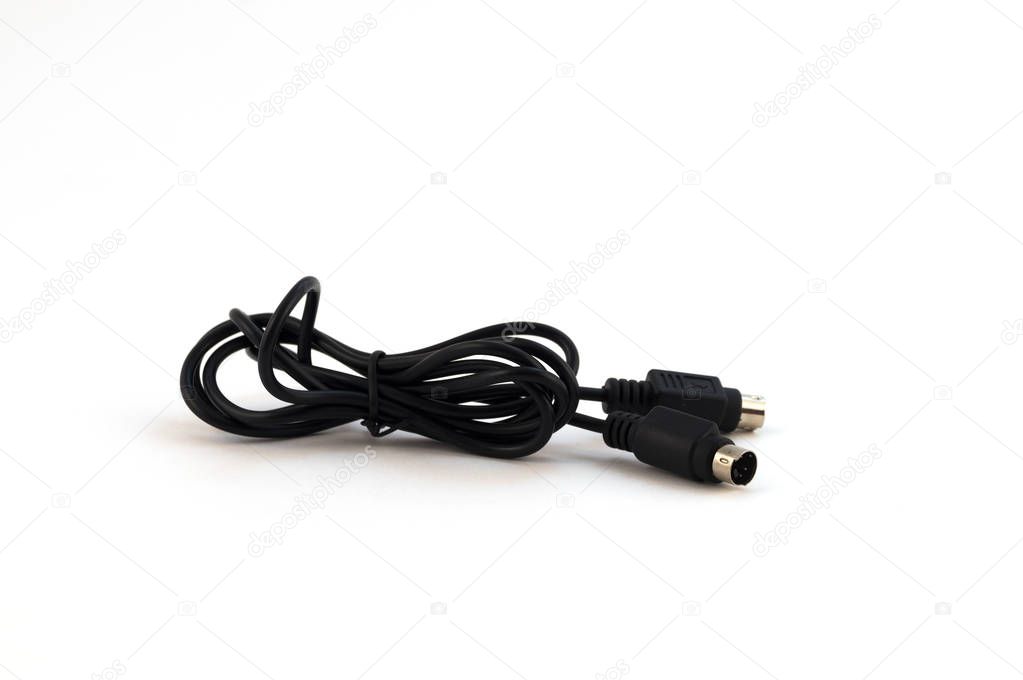 Black thin electric wire for connecting electronic devices with round metal contacts sockets on a white background.