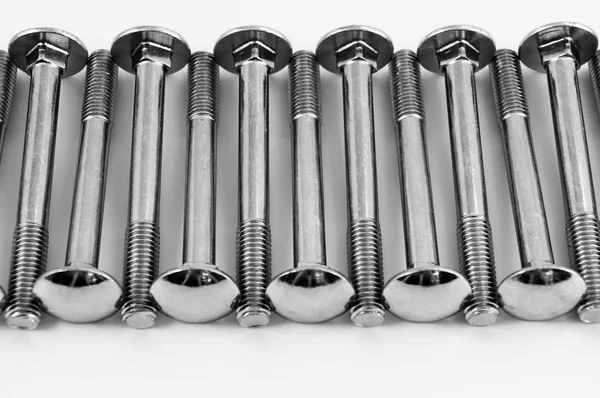 Long Metal Bolts Fastening Parts Laid One Transverse Row White — Stock Photo, Image