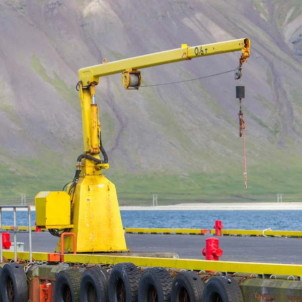 Fishing crane in small seaside Iceland town harbor — Stock Photo, Image