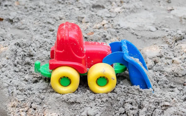 Máquina infantil en la arena — Foto de Stock