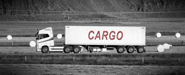 Truck driving through a rural area - Cargo — Stock Photo, Image