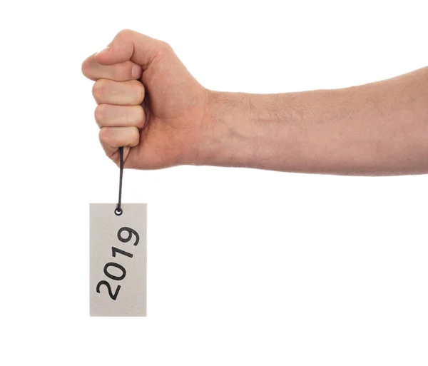 Hand som håller ett tag - nyår - 2019 — Stockfoto