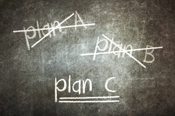 Doorhaling van plan een en plan b en het schrijven van plan c — Stockfoto