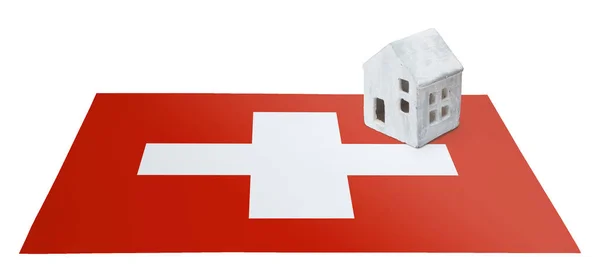 Petite maison sur un drapeau - Suisse — Photo