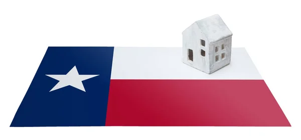 Small house on a flag - Texas — Stock Photo, Image