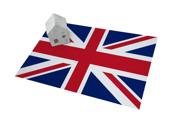 Small house on a flag - UK — Stock Photo, Image