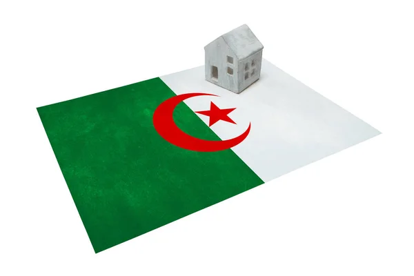 Small house on a flag - Algeria — Stock Photo, Image