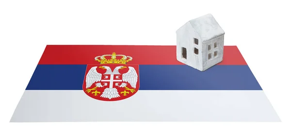 Small house on a flag - Serbia — Stock Photo, Image