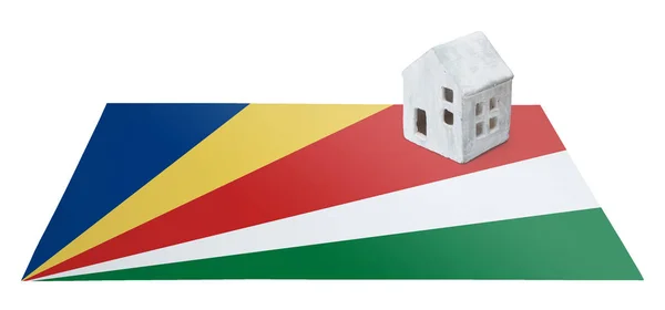 Small house on a flag - Seychelles — Stock Photo, Image