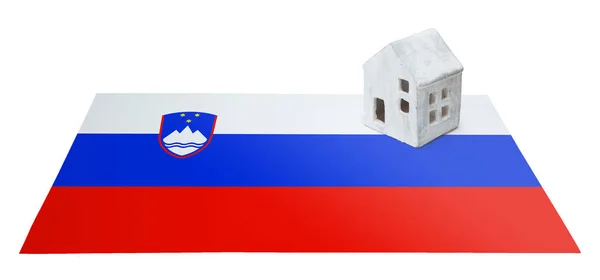 Small house on a flag - Slovenia — Stock Photo, Image