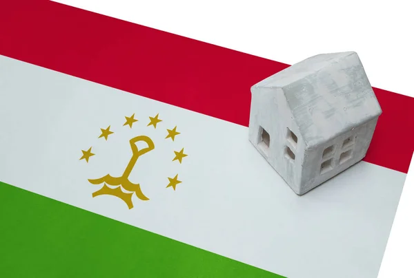 Small house on a flag - Tajikistan — Stock Photo, Image