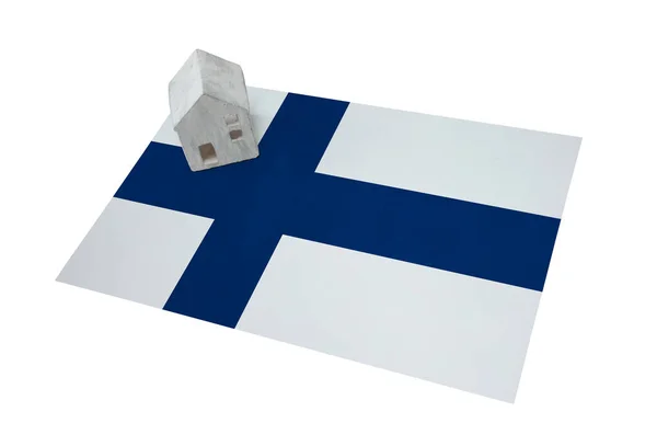 Small house on a flag - Finland — Stock Photo, Image