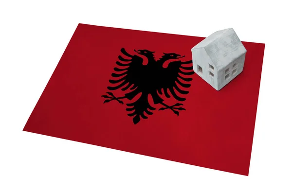 Small house on a flag - Albania — Stock Photo, Image