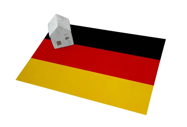 Small house on a flag - Germany — Stock Photo, Image