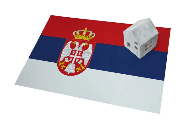 Small house on a flag - Serbia — Stock Photo, Image