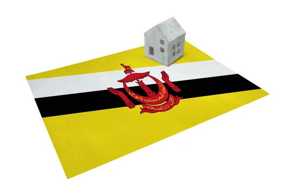 Pequena casa em uma bandeira - Brunei — Fotografia de Stock