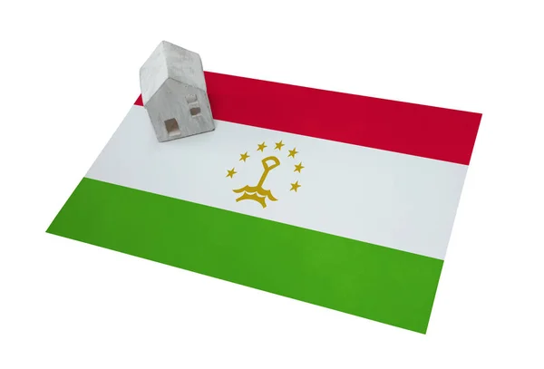 Litet hus på en flagga - Tadzjikistan — Stockfoto