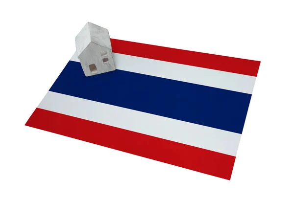 Small house on a flag - Thailand — Stock Photo, Image