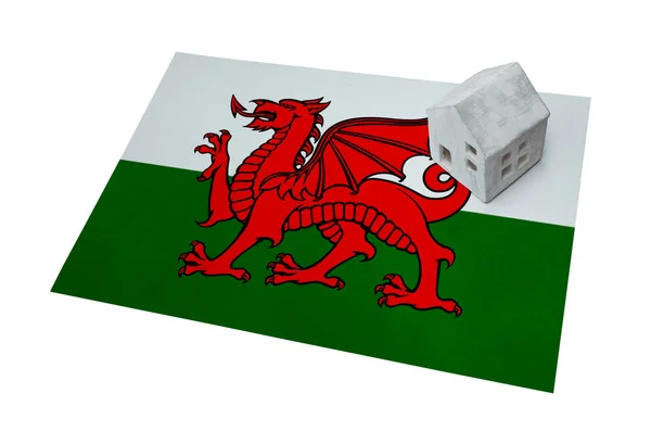 Small house on a flag - Wales — Stock Photo, Image