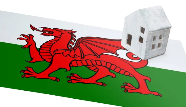 Small house on a flag - Wales — Stock Photo, Image