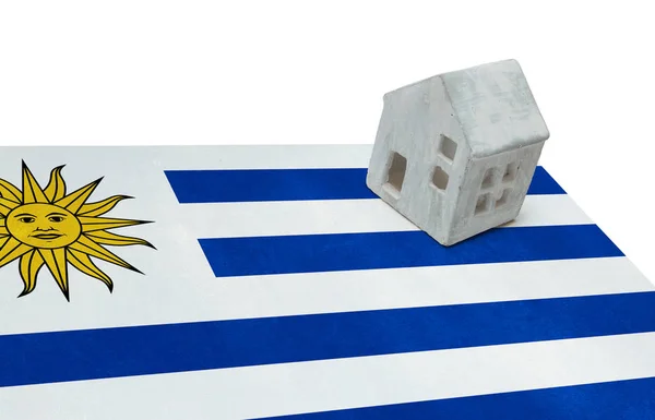 Small house on a flag - Uruguay — Stock Photo, Image