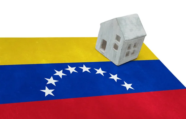 Pequeña casa en una bandera - Venezuela —  Fotos de Stock