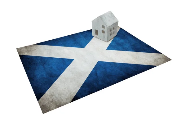 Small house on a flag - Scotland — Stock Photo, Image