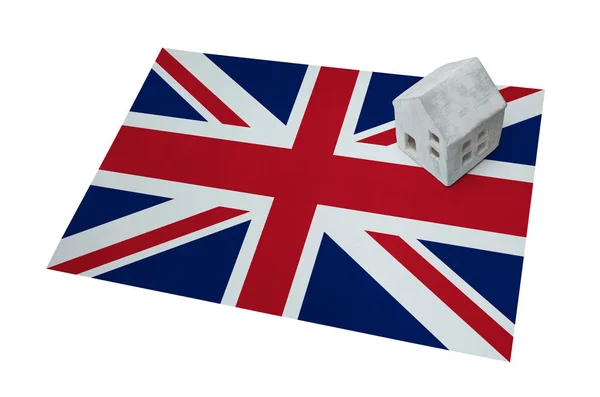 Small house on a flag - UK — Stock Photo, Image