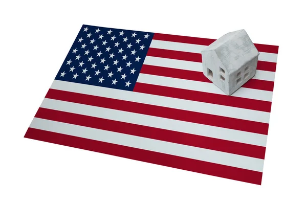 Small house on a flag - USA — Stock Photo, Image