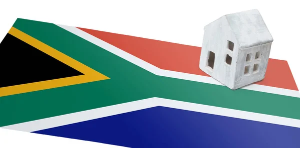 Small house on a flag - South Africa — Stock Photo, Image