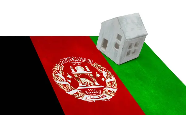 Piccola casa su una bandiera - Afghanistan — Foto Stock