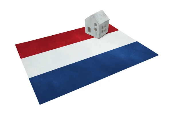Small house on a flag - Netherlands — Stock Photo, Image