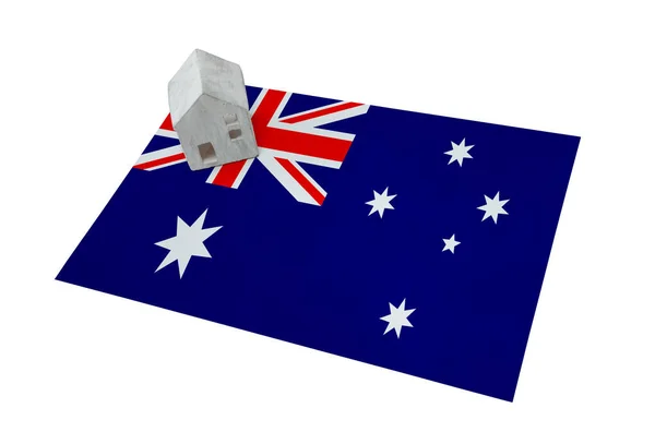 Small house on a flag - Australia — Stock Photo, Image