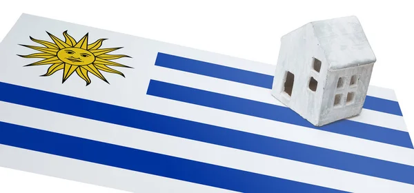 Small house on a flag - Uruguay — Stock Photo, Image