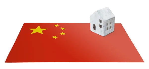 Маленький дом на флаге - Китай — стоковое фото