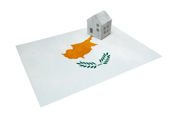 Small house on a flag - Cyprus — Stock Photo, Image