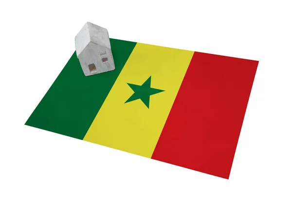 Small house on a flag - Senegal — Stock Photo, Image