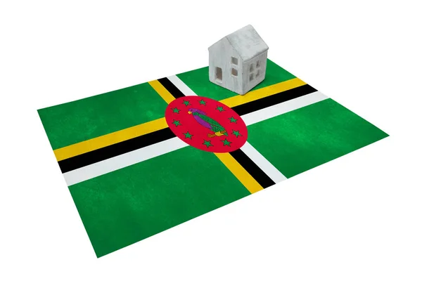 Small house on a flag - Dominica — Stock Photo, Image