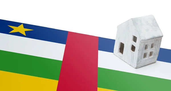 ध्वजावरील लहान घर मध्य आफ्रिकन प्रजासत्ताक — स्टॉक फोटो, इमेज