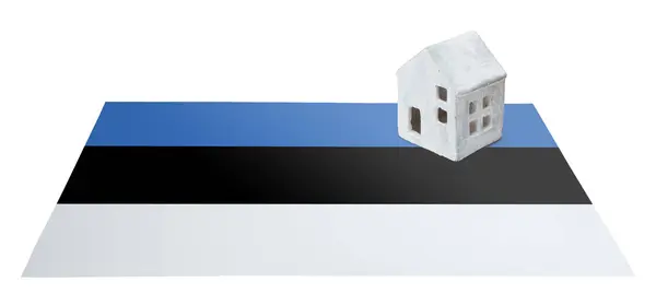 Small house on a flag - Estonia — Stock Photo, Image