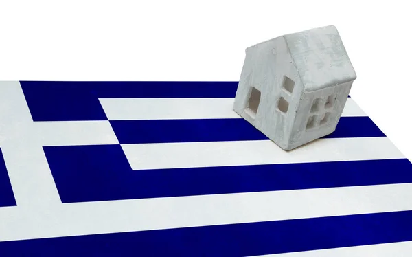 Small house on a flag - Greece — Stock Photo, Image